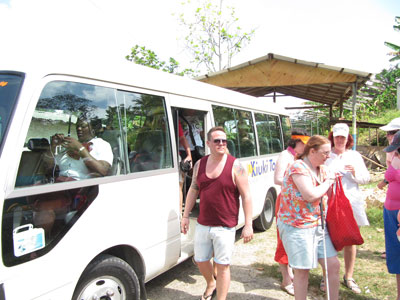 Tour Bus Dropping Tourists Off At Orange Bay